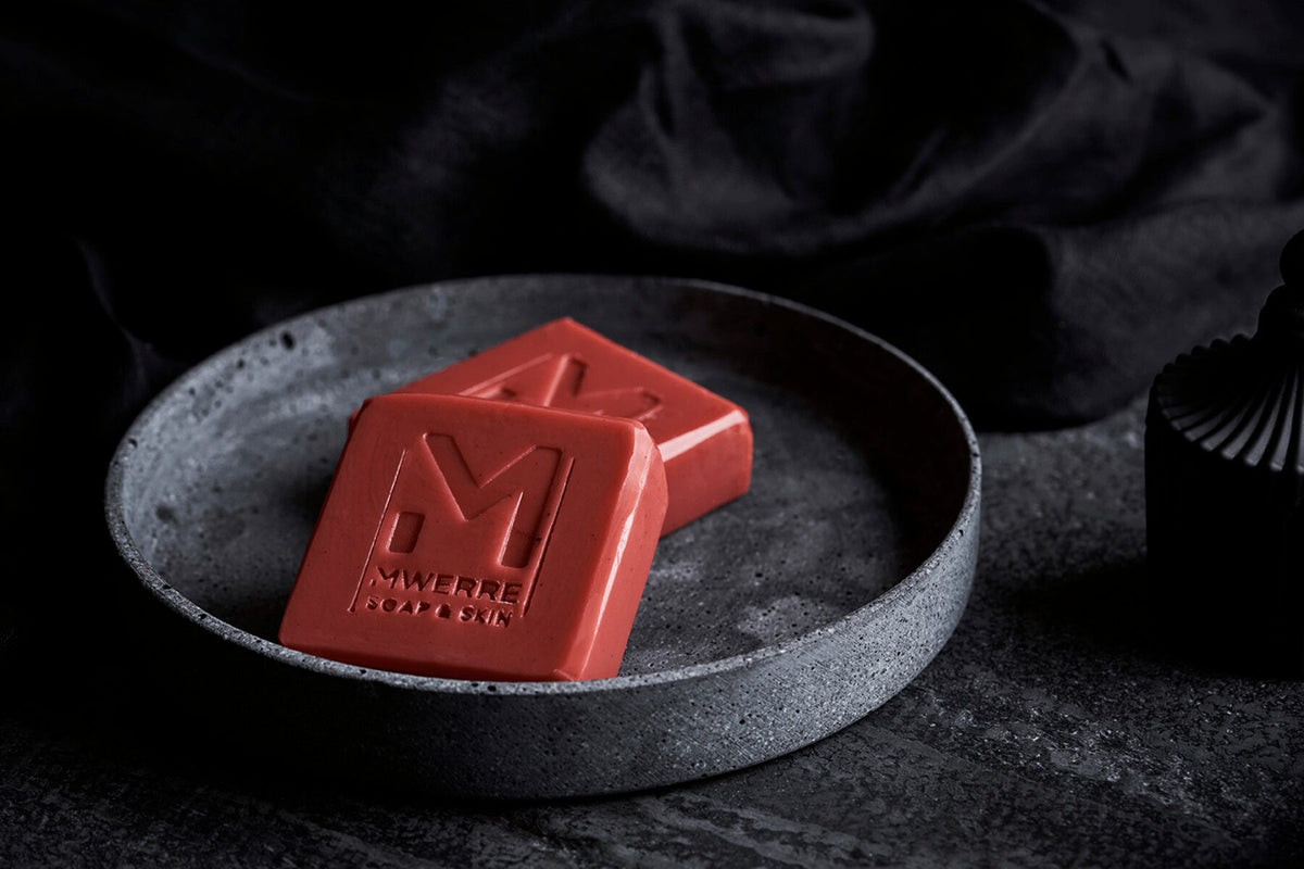 Indigenous Red Ochre clay soap square shaped soaps on a round grey plate