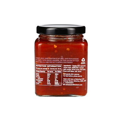 Jar of red sauce with nutrition information label on a white background