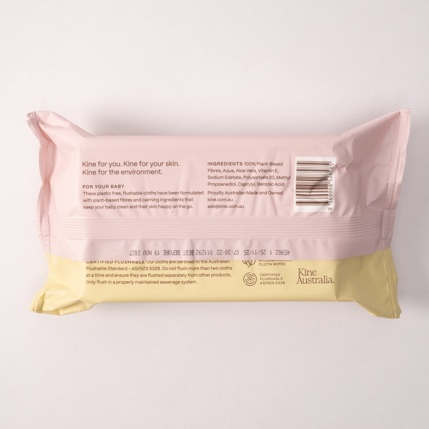 Pink and yellow package of Kine Australia baby flushable wipes on a white background. Baby Wipes Safe for Kids. Biodegradable Travel wet wipes .