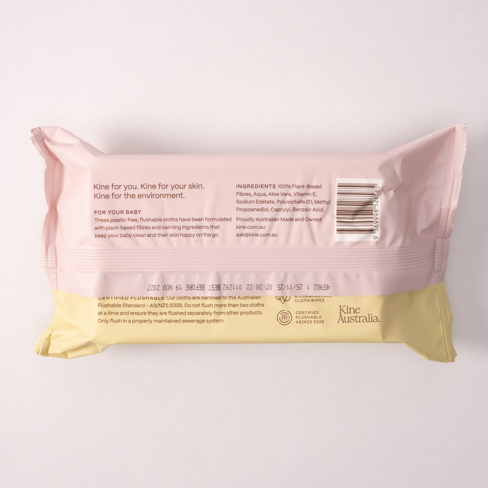 Pink and yellow package of Kine Australia baby flushable wipes on a white background. Baby Wipes Safe for Kids. Biodegradable Travel wet wipes .