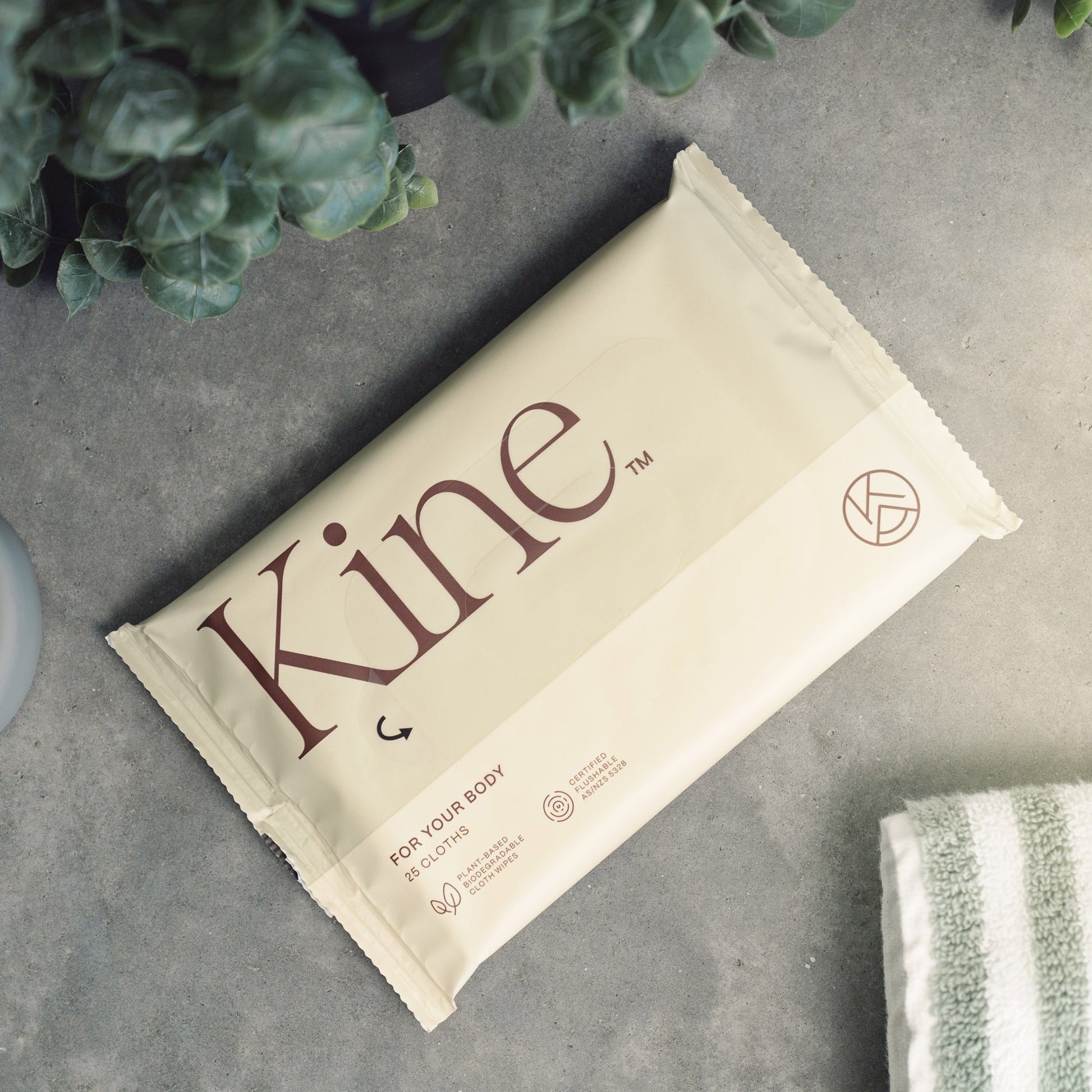 A packaged flushable wipes with the brand name 'Kine' printed on it, indicating it is a eco-friendly product possibly made from plant-based materials.
